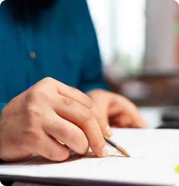 Person reviewing documents and checklist showing guidelines for the Spectrum Win-Win referral programme.