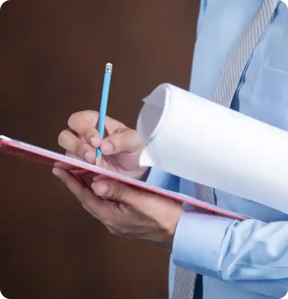 Close-up of hand writing notes to explain Spectrum Win-Win programme details and rewards